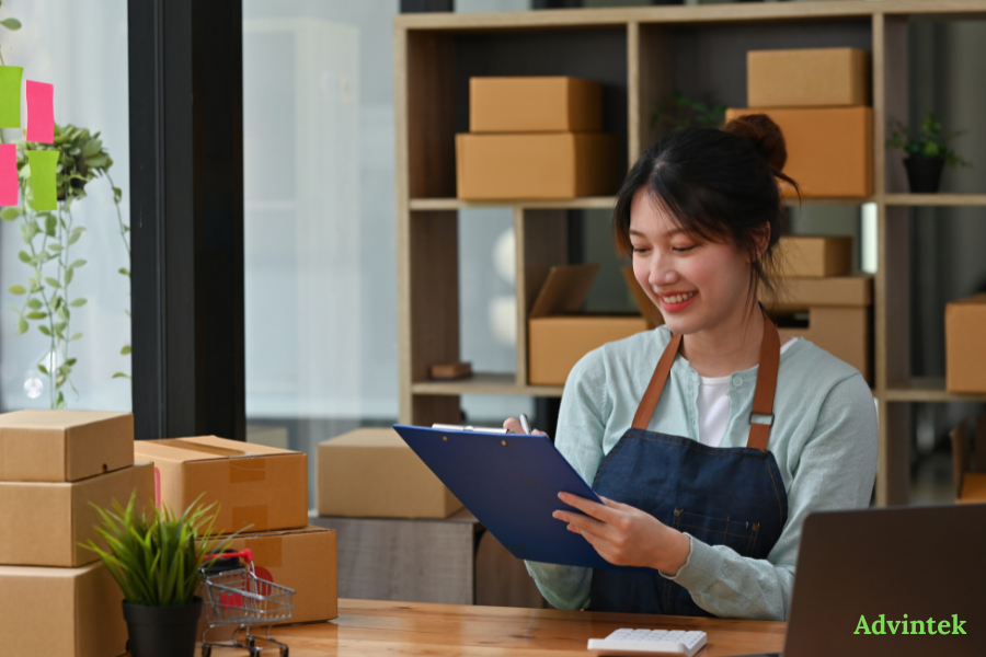 Small business owner reviewing order records for UAE e-invoicing compliance