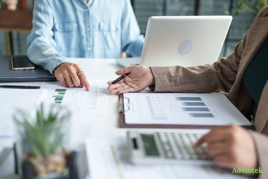 UAE E-Invoicing Pilot Phase July 2026: What Voluntary Early Adopters Must Know 3 Finance team reviewing reports for UAE e-invoicing compliance and invoice automation