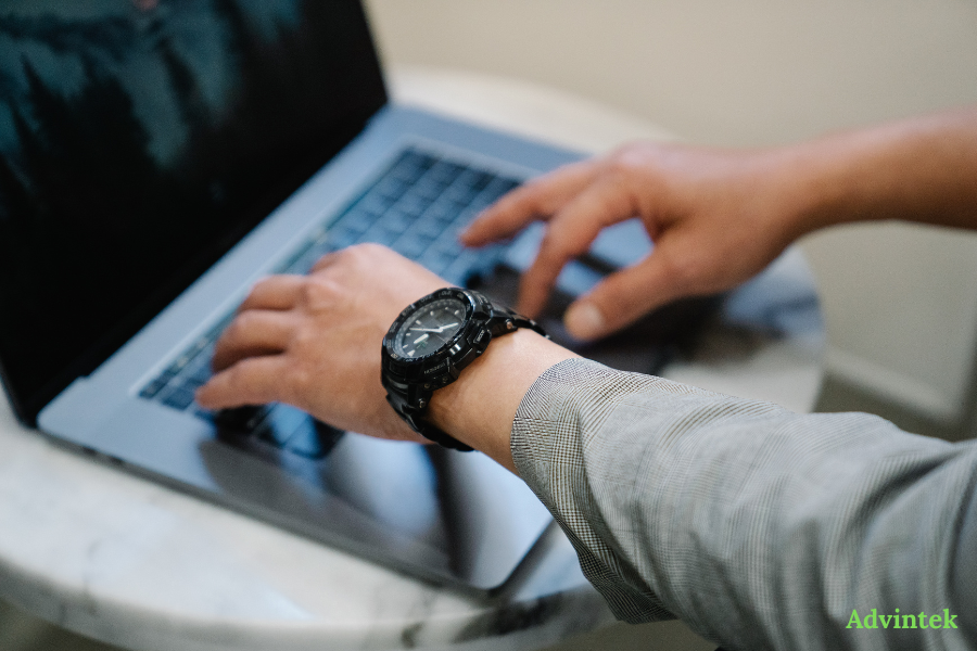Business user reviewing e-invoicing data on laptop for Advintek compliance setup