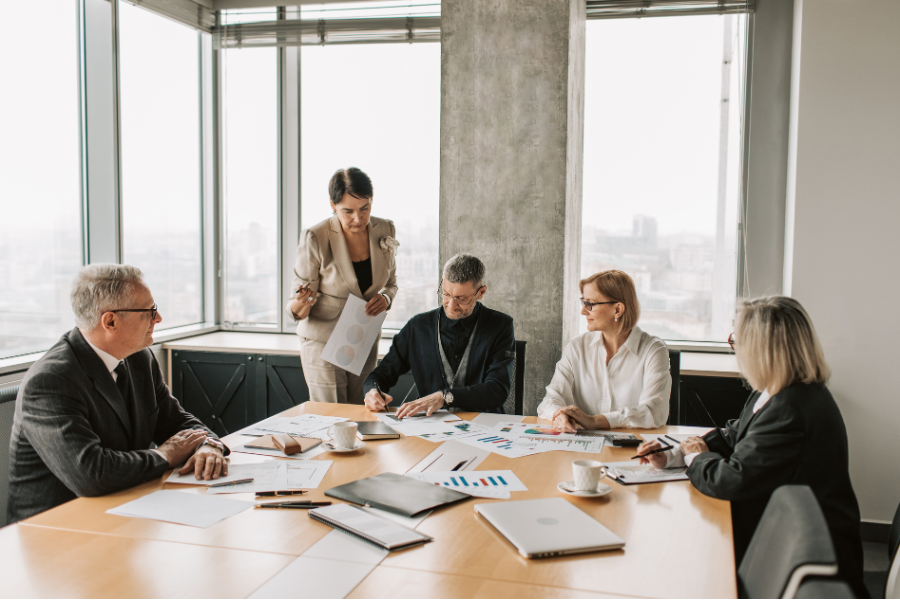 What Happens If You Miss the UAE E-Invoicing Deadline? Breaking Down the Real Cost in AED 2 business discussing invoicing plan with provider