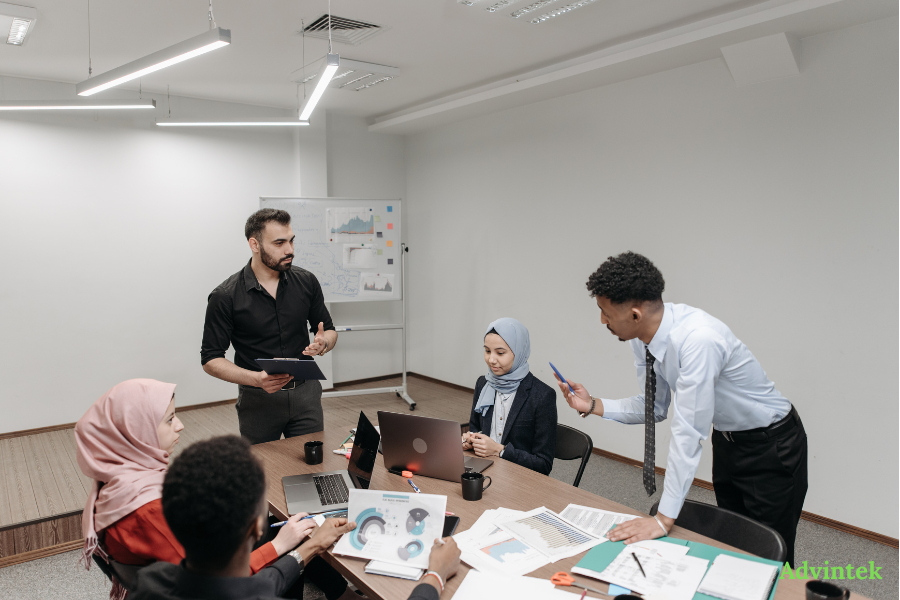 Business team reviewing financial reports and digital invoicing workflows for UAE e-invoicing compliance