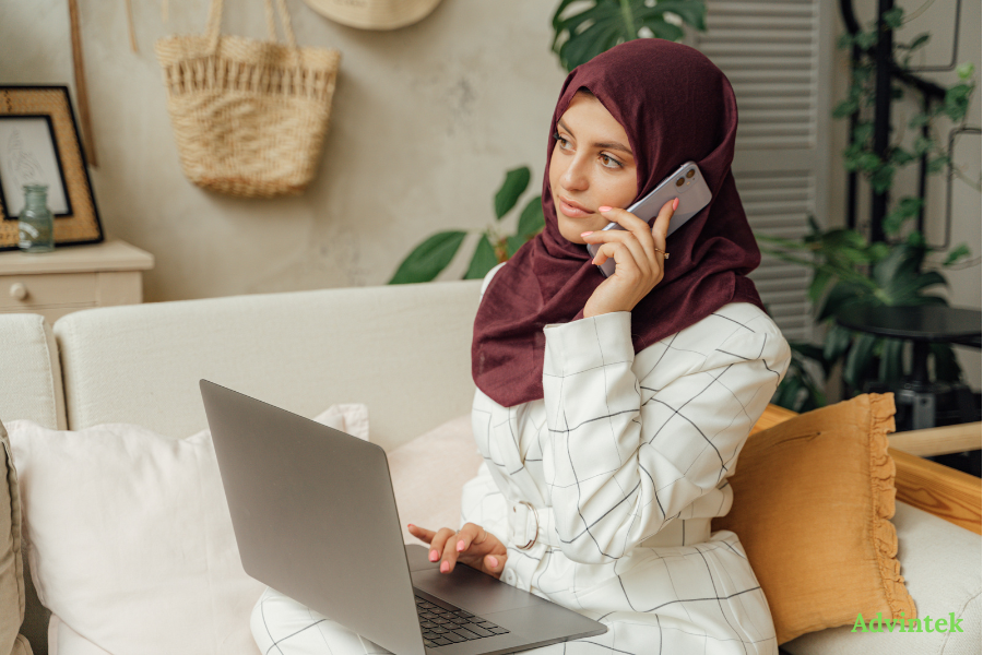 Peppol E-Invoicing and ERP Integration: How Your System Connects to the UAE Network 2 Businesswoman managing invoice communication on laptop and phone with e-invoicing software