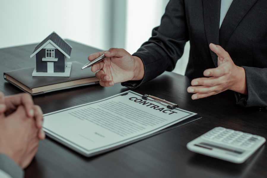 E-Invoicing for Construction and Real Estate: What Retention Billing Rules Actually Mean for You 3 agent discussing property contract